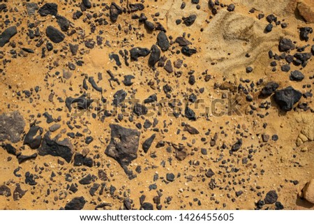 the beautiful hot desert of many black stone from volcano or lava stone in Egypt name black desert