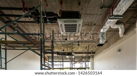 Construction area during preparation for interior decoration of modern buildings consisting of a steel frame Lighting system Air conditioning system water supply pipe.