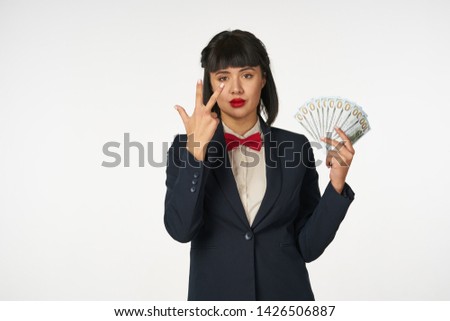  business woman in suit holding money                              