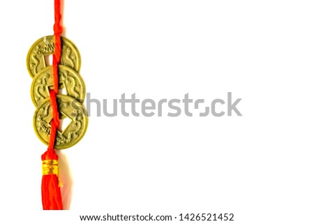 Chinese new year decoration Old golden feng shui lucky happy wealth coin money with clipping path for good fortune and success on white background close-up