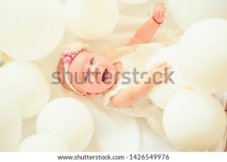 Only fresh and healthy food for my baby. Sweet little baby. New life and birth. Small girl. Happy birthday. Family. Child care. Childrens day. Portrait of happy little child in white balloons.