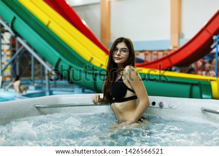 Beautiful girl relaxing at a water park