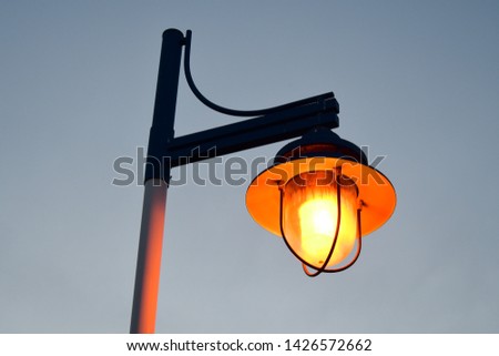a lonely street lantern on a grey sky background at Sparks marina park, Sparks Nevada