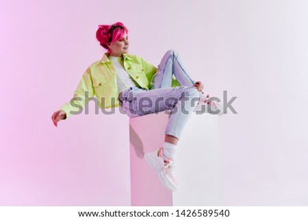 light woman sitting on a cube retro fashion style