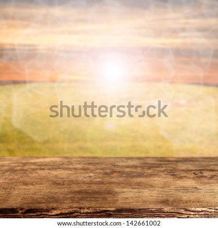 sun and desk of worn wood
