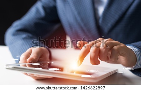 Digital technologies in modern business concept. Businessman hands using tablet computer. Virtual interface on tablet computer screen. 3d data visualization at gadget. Online marketing and analytics