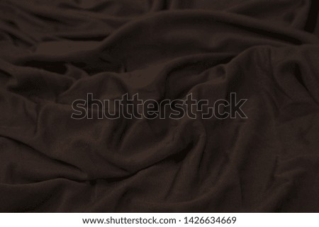 
Wrinkles on brown cotton fabric, background, texture .