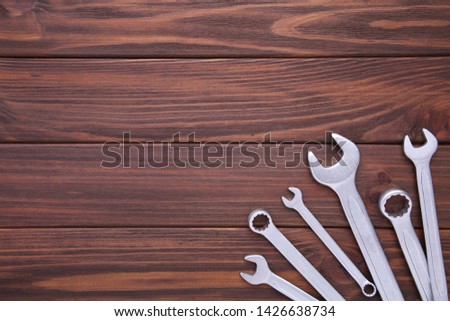 Combination wrenches for repair on brown table