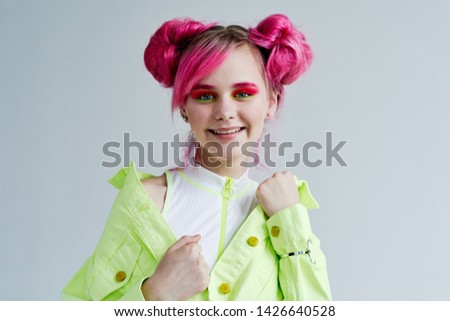 woman in stylish clothes with pink hair smiling
