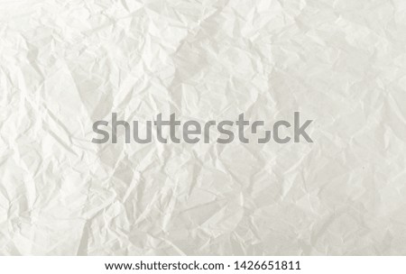 Sheet of White Thin Crumpled Craft Paper Background Top View. Wrinkled Grey Wrapping Paper Texture or Pattern