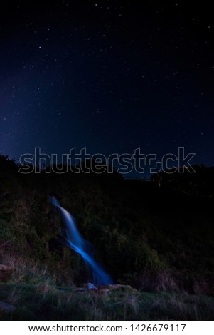 waterfall and stars at nightfall
