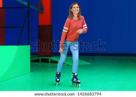 Woman having fun at roller skating rink