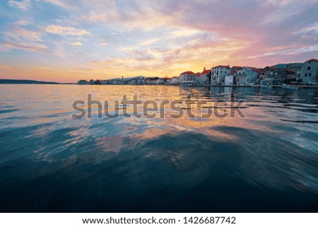 Beautiful sunset landscape. Old croatian town on the sea shore.