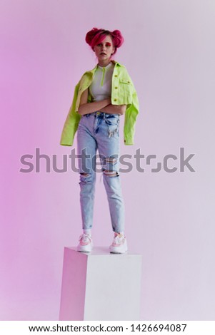 woman standing on a cube