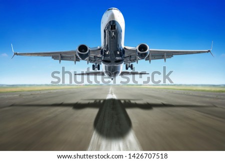 take off of an modern airliner against a blue sky Royalty-Free Stock Photo #1426707518