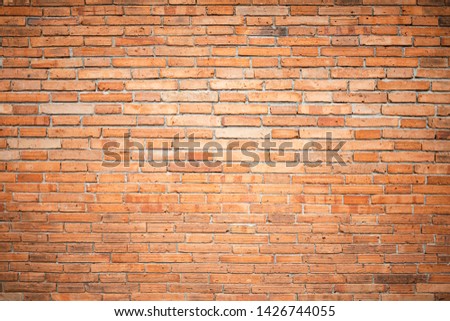 Old brick wall texture and background, orange block and increase exposure in the center