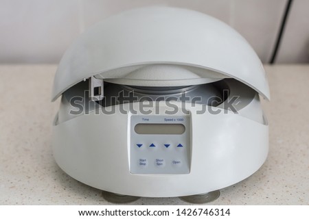 centrifuge, electronic apparatus designed to separate suspensions, sludges, emulsions into components or remove liquids from materials with high humidity under the action of centrifugal forces. Royalty-Free Stock Photo #1426746314