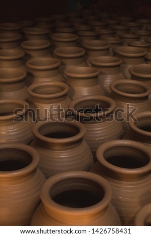 A collection of freshly made pots left to dry