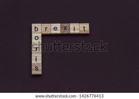 Boris and Brexit, like a crossword, in children letter blocks, landscape Royalty-Free Stock Photo #1426776413
