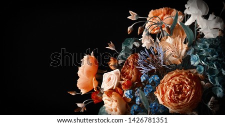 Beautiful bunch of colorful flowers on black background in vintage style.  Festive flowers concept with copy space.