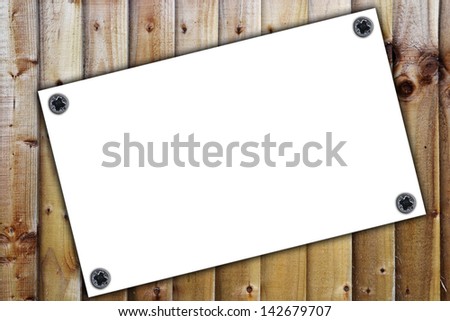 White paper on the wooden background