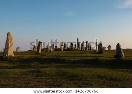 Looking up at the Calanais Standing Stones during sunset