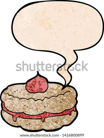 cartoon biscuit with speech bubble in retro texture style