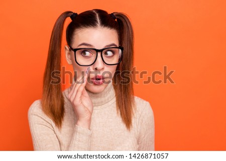 Close up photo of cute childish lady high school place palm hand near excited mouth look share private information novelty wear light-colored trendy stylish turtleneck isolated orange background