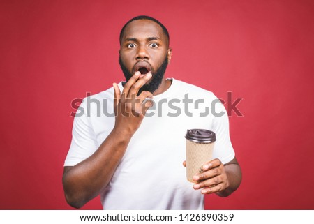 Portrait of shocked Afro American man on studio. Black male with surpised expression. Royalty-Free Stock Photo #1426890359