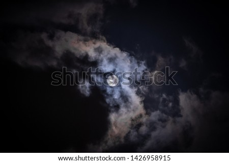 Moon in the night clouds