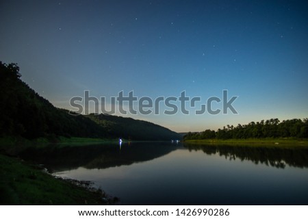 Wooded banks of the river Dniester on a summer night