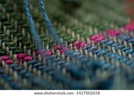 closed up and partially blur of yarn on cloth 