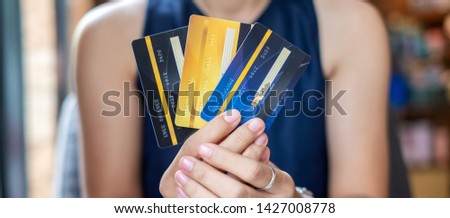 Young casual Business woman holding credit card  for online shopping while making orders in the cafe.business, lifestyle,technology,ecommerce and online payment concept