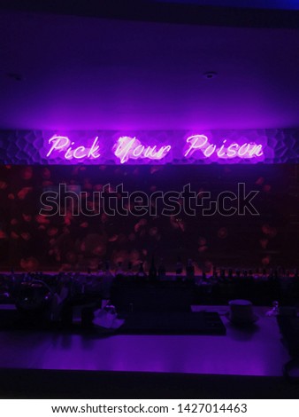 Pick your poison neon signage for a business