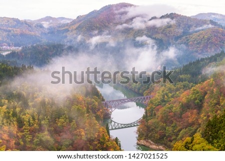 First bridge and Tadami river in beautiful autumn season.