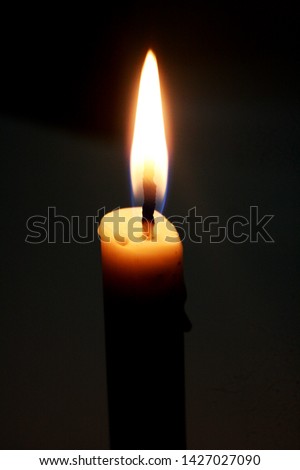 close up view candle light on dark background
