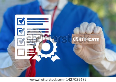 Certificate Healthcare Pharmacy concept. Pharmacist or doctor holds wooden block with certificate word and touches document with stamp icon. Quality Standard Certification Medicine. Royalty-Free Stock Photo #1427028698