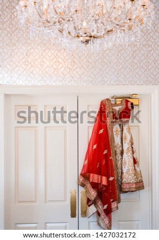 Pakistani Indian bridal wedding red & white ghoonghat and lehenga outfit Royalty-Free Stock Photo #1427032172