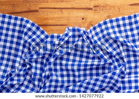 blue table cloth on wooden background