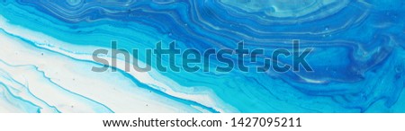 photography of abstract marbleized effect background. blue and white creative colors. Beautiful paint. banner