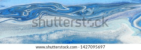 photography of abstract marbleized effect background. blue and white creative colors. Beautiful paint. banner