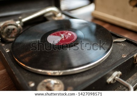 Obsolete retro vinyl record disk player in old box