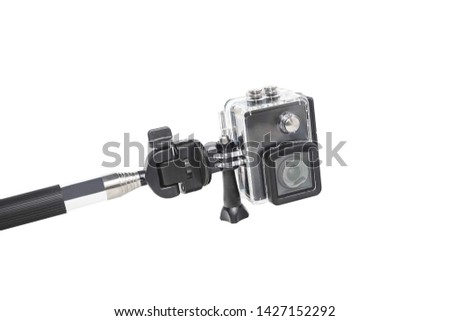 Action camera with handheld stick isolated on white background.