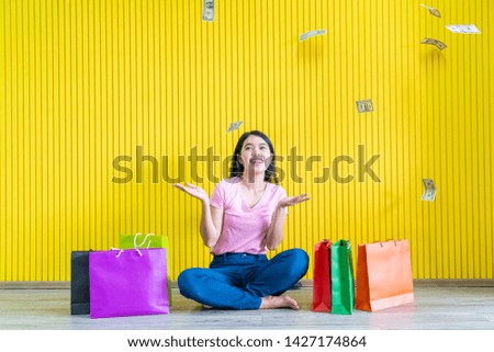 Asian women shopping addicted holding shopping bags