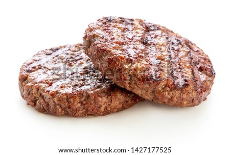 two grilled minced meat cutlets isolated on white background Royalty-Free Stock Photo #1427177525