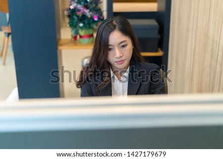 Asian business woman stress from work in the office