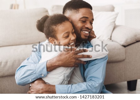 I Love You, daddy! Cute Daughter Hugging Father With Love And Tenderness At Home