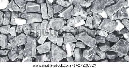 Pattern of gravel, rock or small stone for background in black and white style. Hard material, Art wallpaper and Group of object concept 