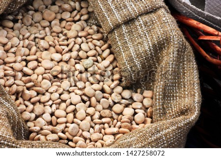 dried lupine seeds in a satchel bag. close-up Royalty-Free Stock Photo #1427258072