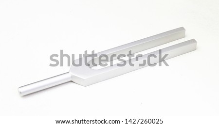Tuning fork on white table